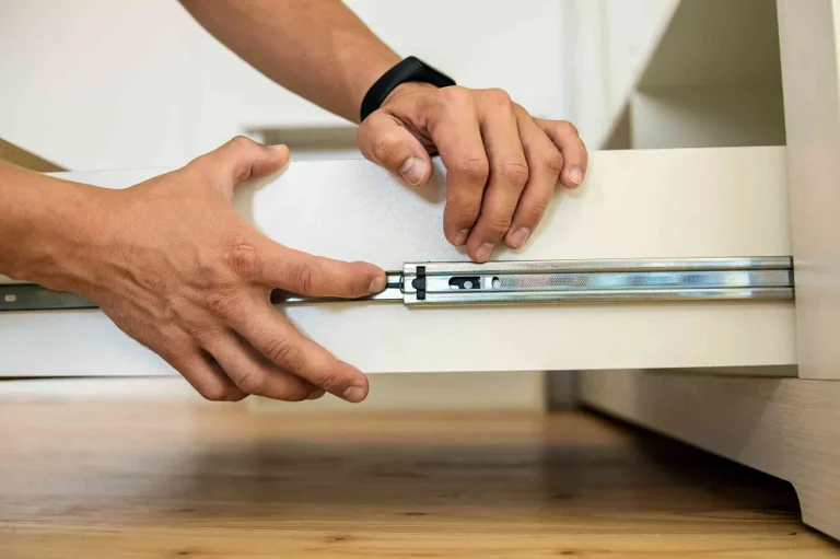 how do you fix a cabinet drawer that won't stay closed